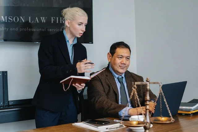 legal-specialist-taking-notes-from-a-senior