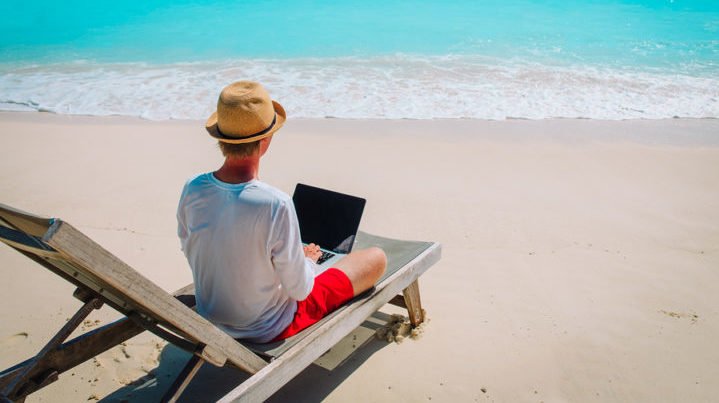 Small Business Owner Working Remotely From a Beach