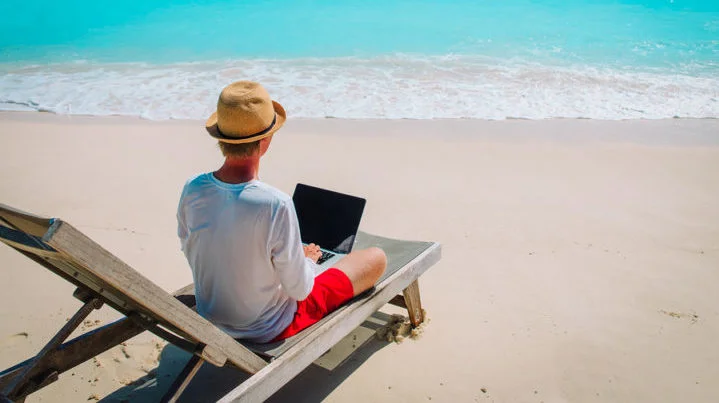 Small Business Owner Working Remotely From a Beach